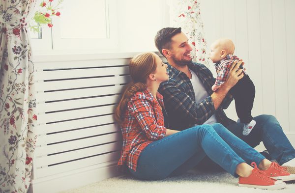 mother and father playing with a baby