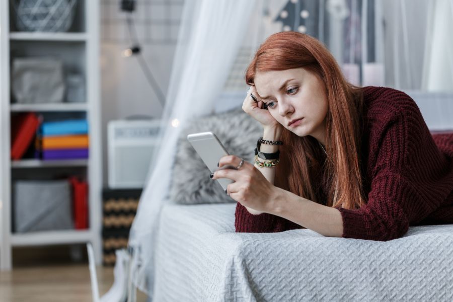 Woman holding phone no contact